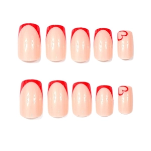 Red French tip press-on nails with heart patterns on glossy nude pink square nail tips