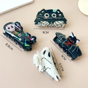 Halloween claw clips set with spider, skull, bat and ghost designs in black and white