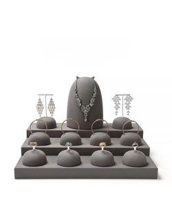 Luxury jewelry display stand with necklace earrings bracelets and gem rings on velvet