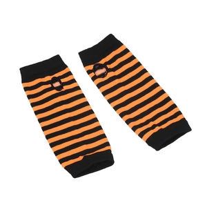 Detail of striped knitted arm warmers in orange and black with thumb hole design