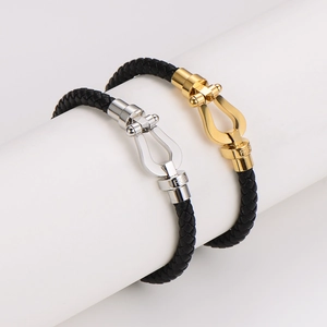 Bracciale intrecciato con fibbia a ferro di cavallo in acciaio inossidabile bicolore