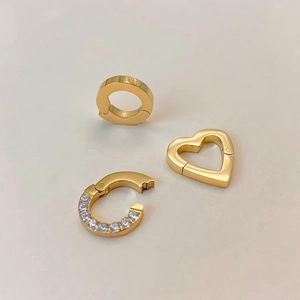 Close-up of gold-plated titanium steel heart and crystal-studded connectors for jewelry