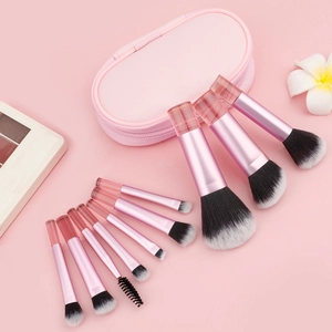 Pink makeup brush set with 10 pieces and matching zipper storage bag in macro view