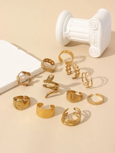 Detail of 11pcs vintage gold plated ring set including heart and snake designs