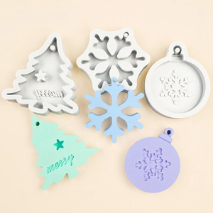 Christmas silicone molds for snowflake, tree, and round ornaments with Merry text