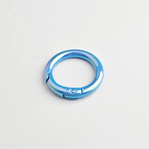 Macro shot of iridescent blue electroplated alloy spring ring clasp for DIY jewelry