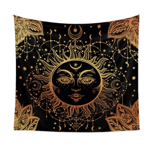 Detailed close-up of Bohemian sun and moon celestial tapestry with gold embroidery on black