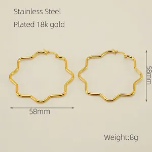 Detailed view of 58mm irregular wavy 18K gold plated stainless steel hoop earrings
