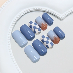 Blue checkerboard and brown smudge gradient press-on nails in a medium-short square shape