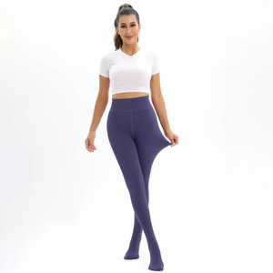 Detail of high-elasticity fabric on dark purple high-waisted thermal leggings for women