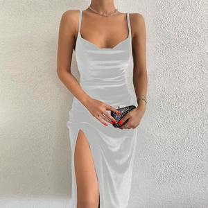 Close-up of elegant silver satin slip dress with a high side slit for a stylish look