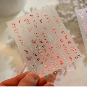 Macro detail of M1345 nail art sticker showing red bamboo and butterfly 3D relief texture