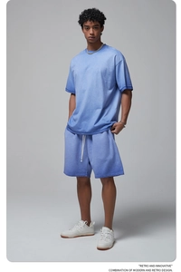 Detail of gradient blue cotton summer set with short sleeve t-shirt and drawstring shorts