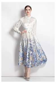 Detailed view of satin floral maxi dress with lantern sleeves and belted waist design