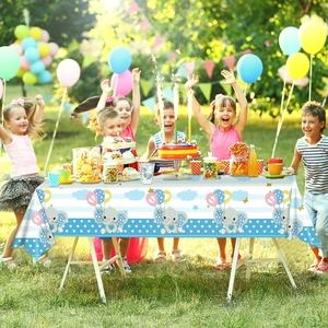 Close-up of navy blue party tablecloth featuring cute elephant with balloons and stripes