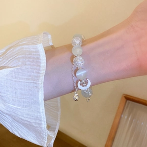 Vintage opal beaded bracelet with crescent moon and bell charms in elegant silver finish
