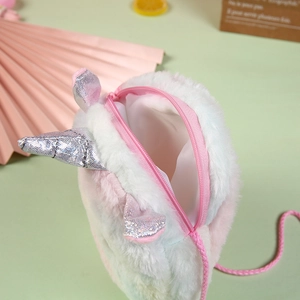 Detail of plush unicorn bag showing rainbow faux fur texture and silver sequin horn detail
