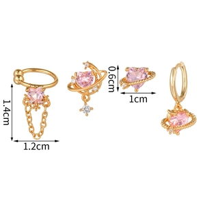Detail view of pink heart earring set with gold planet and star accents in 4 pieces
