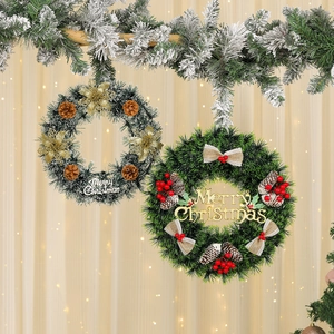 Detail of Christmas wreaths with pine needles, pinecones and Merry Christmas signs