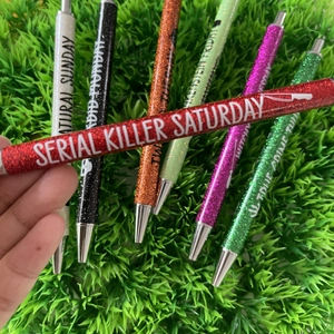 Glitter ballpoint pen set for Halloween with themed slogans and metallic finishes