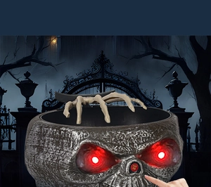 Halloween skeleton candy bowl detail showing hand pressing the Try Me button with red eyes