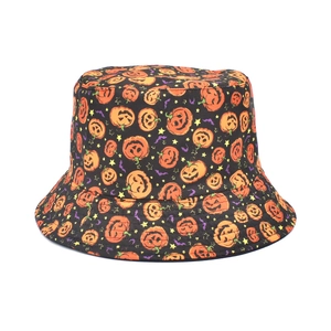 Detail of Halloween bucket hat with orange pumpkin and purple bat patterns on black fabric