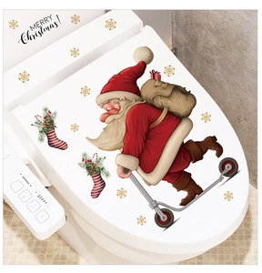 Detail of Christmas Santa toilet lid decals with snowflakes and Merry Christmas text