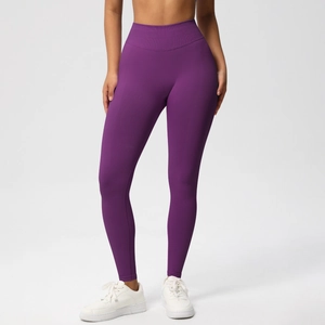 Detail of high-waist seamless compression waistband on dark purple yoga leggings