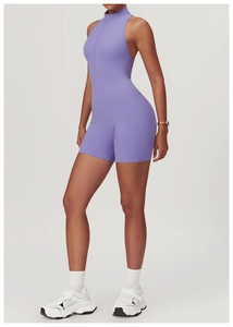 Macro detail of lavender high-stretch athletic romper with half-zipper and high neckline