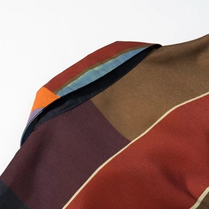 Stylish long sleeve shirt with multi-color patchwork design and silky satin texture