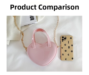 Pink heart-shaped jelly bag with gold chain shown next to a phone for size reference