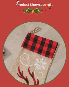 Detail of Christmas stocking with plaid fabric, linen texture and reindeer embroidery