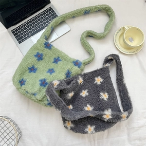 Flat lay of plush floral tote bags with sheepskin faux fur texture and wide straps