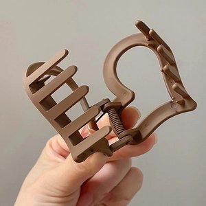 Brown matte heart-shaped claw clip made of durable plastic for women's hair styling