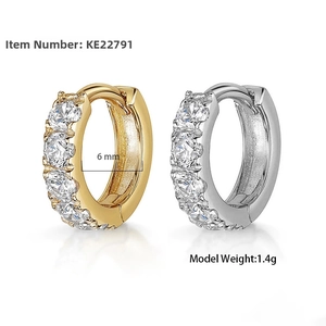 Detailed view of 6mm zircon paved hoop earrings in gold and silver finish