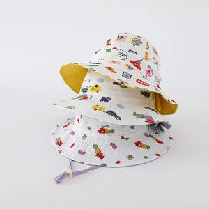 Close-up of three stacked cartoon print bucket hats with adjustable windproof drawstrings