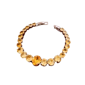 Luxury silver bracelet with gradient yellow zircon crystals and central oval gemstone