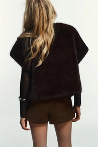 Back view of a deep brown faux mink fur vest showcasing long plush texture and premium fit