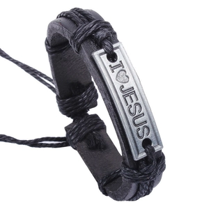 Macro detail of black leather woven bracelet with I Love Jesus metal engraving