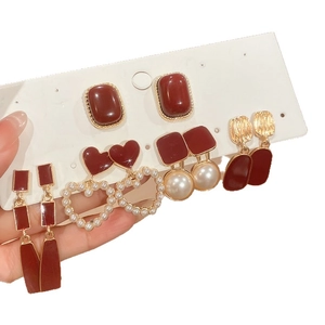 Five-piece red pearl earring set with vintage heart and geometric designs in gold