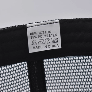 Close-up of fabric care label on mesh ponytail cap showing 65% cotton material