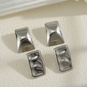 Irregular textured rectangle stud earrings in polished silver and wave stainless steel