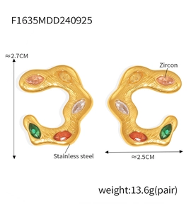 Detailed view of 18k gold plated C-shaped earrings with colorful marquise zircons