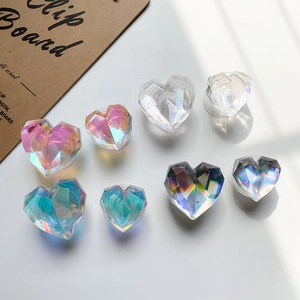 Detailed view of colorful laser heart-shaped phone grips with faceted crystal texture