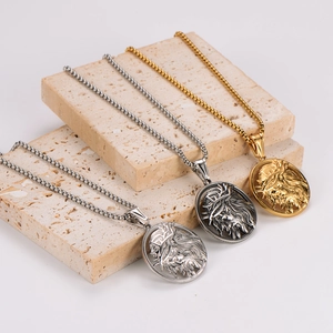 Vintage Greek lion head pendant necklaces in gold, silver and dark steel on stone
