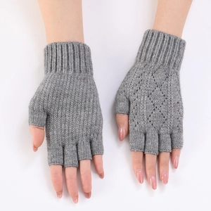 Detailed view of grey knitted fingerless arm sleeves with diamond openwork pattern