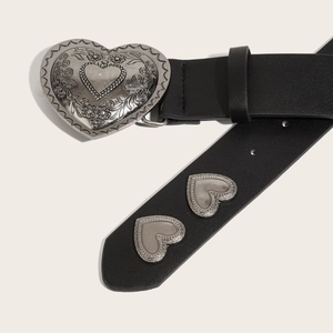 Fashionable black leather belt with silver heart-shaped engraved buckle and metal rivets