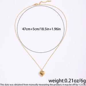 Detailed view of gold heart necklace with I Love You Today, Tomorrow, Always engraving