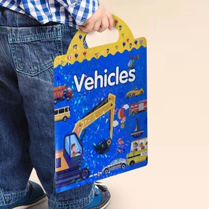 Close-up of a child holding the portable Vehicles sticker book with a glittery blue cover