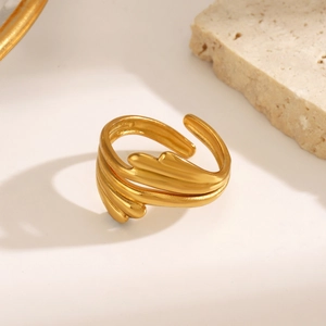 Minimalist gold stainless steel open ring with a layered leaf and feather-like design